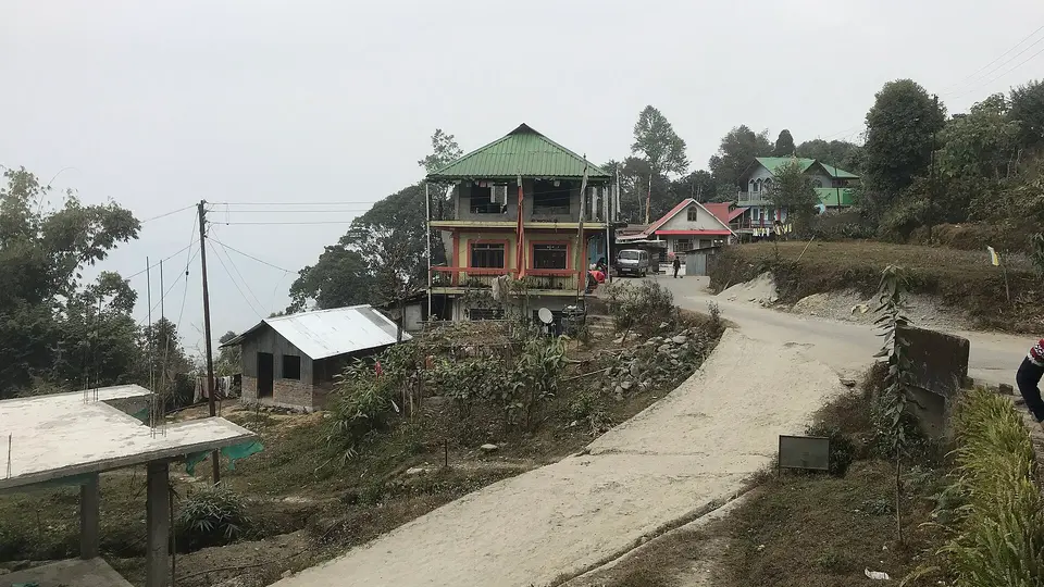 Village road and homes at Upper Sittong