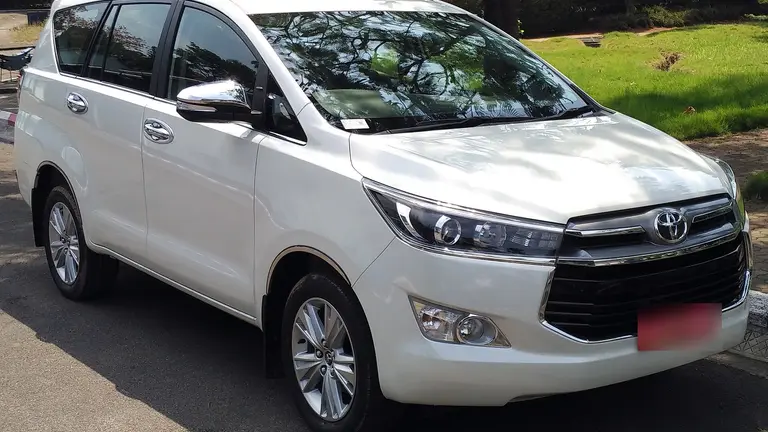 White Toyota Innova Crysta ready for an executive pickup