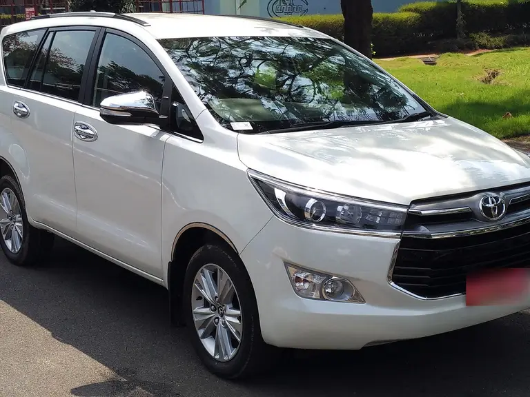 White Toyota Innova Crysta, front three-quarter view